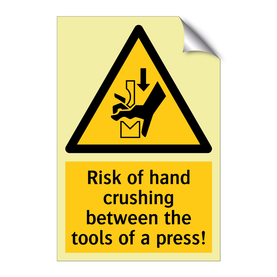 Risk of hand crushing between the tools of a press!